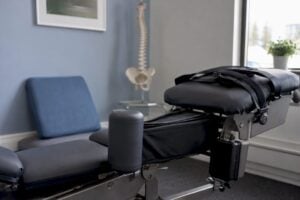 Motorized spinal decompression traction table in clinical room
