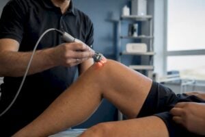 Cold laser therapy applied on patient's knee